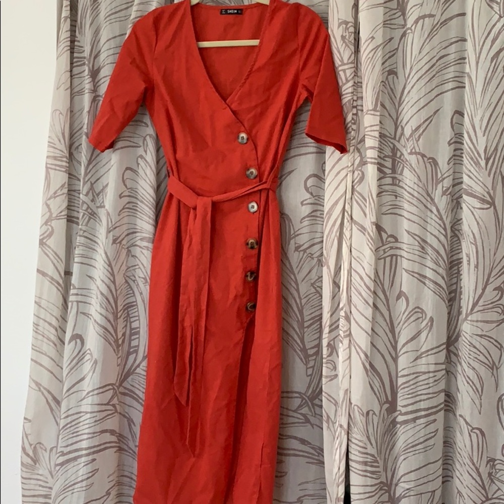 NWOT.   Button down dress with high slit and belt